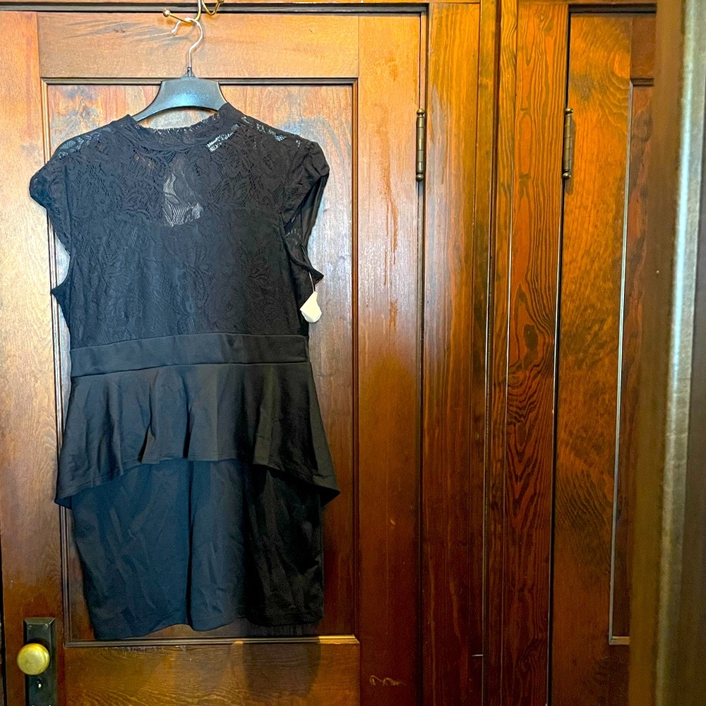 Black, lace top peplum dress, with keyhole back. Never worn, reposhed.